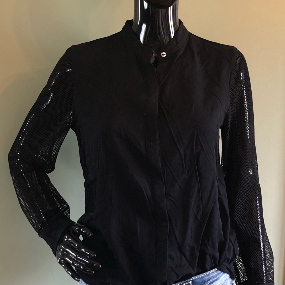 Black button up with skull buttons and mesh arms.